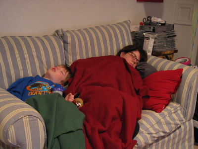 Ann and Jack asleep on the loveseat.